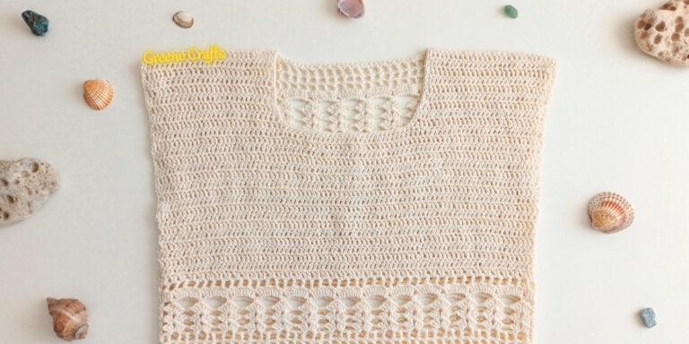 Close-up of the Summer Breeze crochet top showing the solid bust panel and lace body